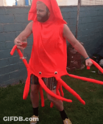 Man In Squid Costume Holding Wine Glass GIF