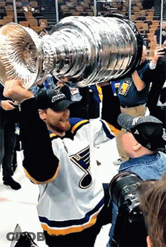 Man In St. Louis Blues Jersey Holding Trophy GIF