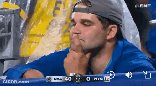 Man In Stadium Watching Football Score DAL 40 0 NYG GIF