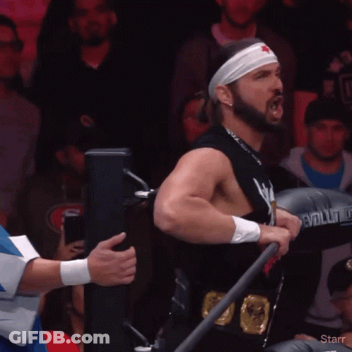 Man In Star Headband Holding Evolution Boxing Glove GIF