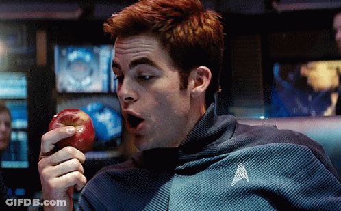 Man In Star Trek Jacket Holding Apple GIF