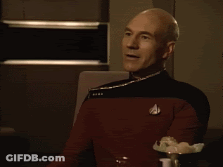 Man In Star Trek Uniform Clapping And Smiling GIF