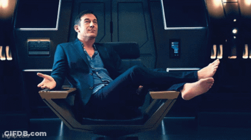 Man In Star Trek Uniform Holding Gun GIF