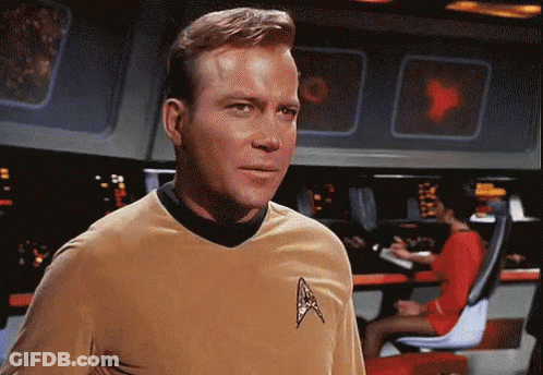 Man In Star Trek Uniform Looking At Camera GIF