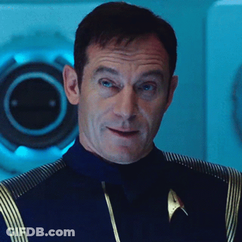 Man In Star Trek Uniform Looking At Camera GIF