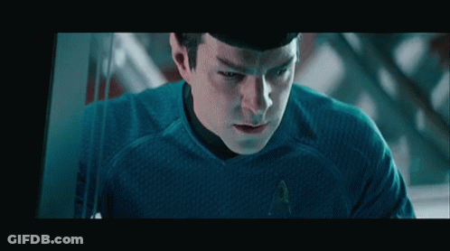 Man In Star Trek Uniform Looking GIF