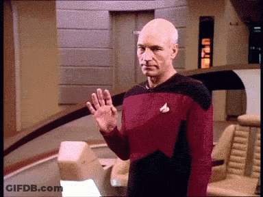 Man In Star Trek Uniform Waving GIF