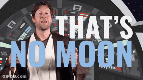 Man In Star Wars Costume In Front Of Sign Saying That's No Moon GIF