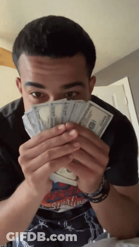 Man In Starting Shirt Holding Money GIF