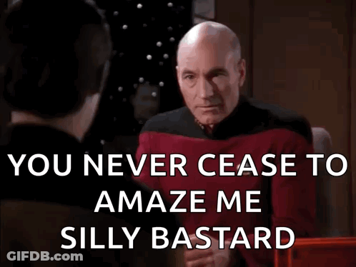 Man In Stoixima Shirt Talking On Phone GIF