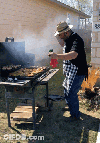 Man In Straw Hat Grilling Outdoors GIF