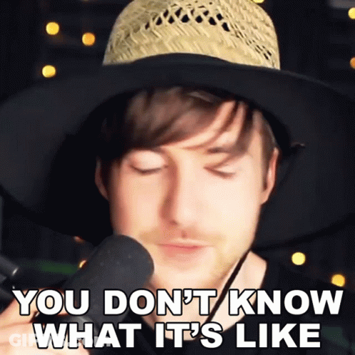 Man In Straw Hat Holding Microphone GIF