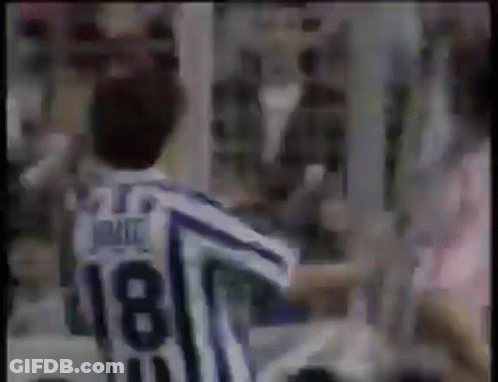 Man In Striped Jersey Number 18 In Front Of Crowd GIF