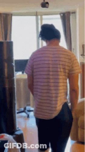 Man In Striped Shirt And Black Pants GIF