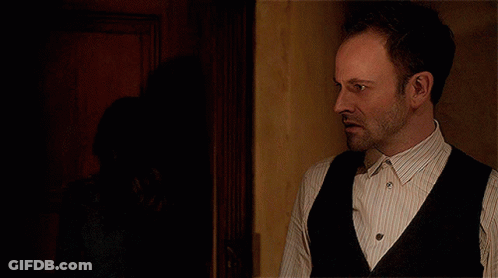Man In Striped Shirt And Black Vest GIF