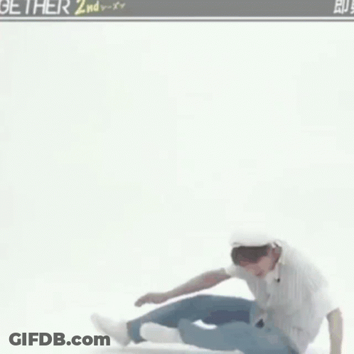 Man In Striped Shirt And Blue Jeans Dancing GIF