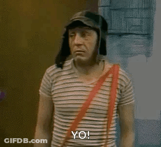 Man In Striped Shirt And Hat In Front Of Door GIF