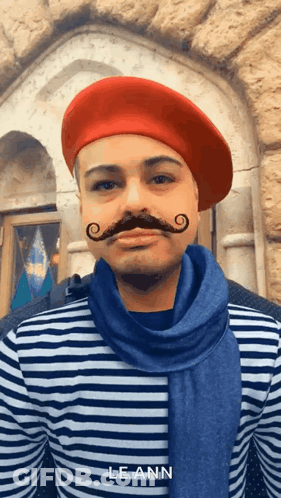 Man In Striped Shirt And Red Beret With Leann GIF