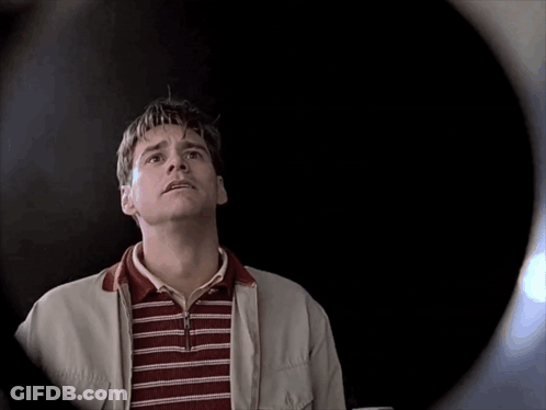 Man In Striped Shirt And White Jacket Looking Up GIF
