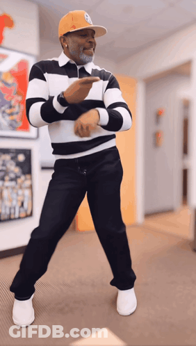 Man In Striped Shirt And Yellow Hat Dancing GIF