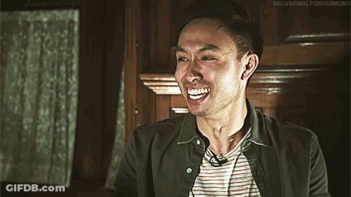 Man In Striped Shirt Green Jacket Smiling Delusionalforharmony GIF
