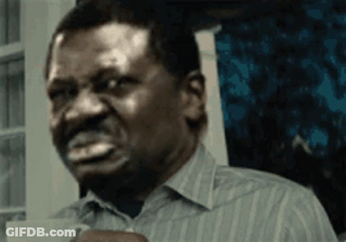 Man In Striped Shirt Holding Coffee GIF