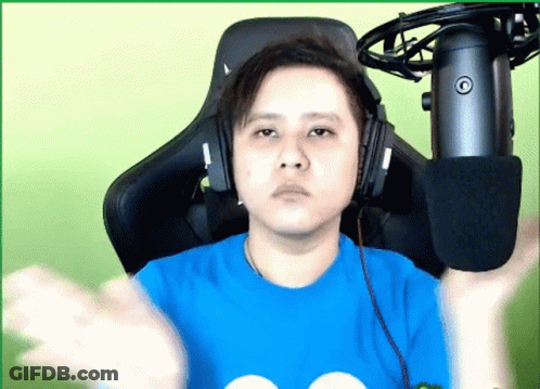 Man In Striped Shirt Holding Gun To Ear GIF