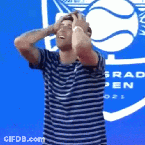 Man In Striped Shirt Holding Head Grad Open GIF