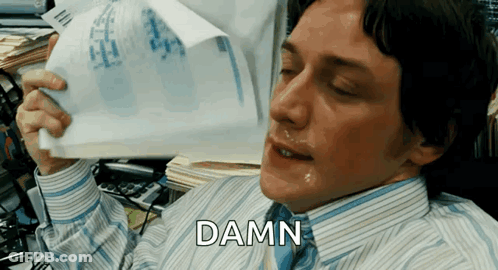 Man In Striped Shirt Holding Paper Damn GIF