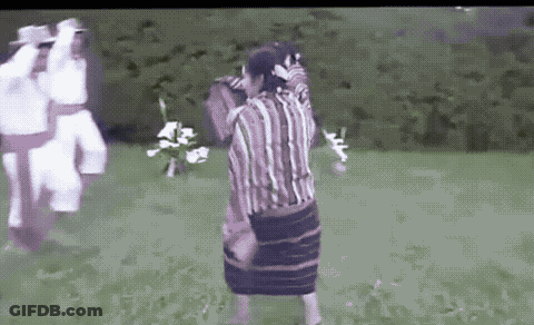 Man In Striped Shirt Holding Woman In Skirt GIF