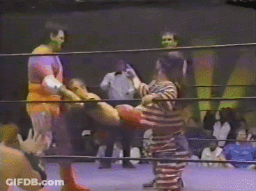 Man In Striped Shirt In Boxing Ring GIF