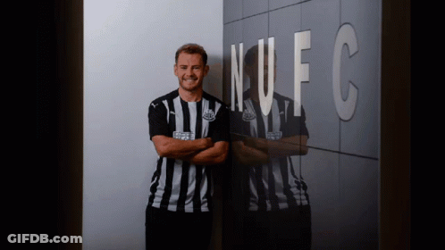 Man In Striped Shirt In Front Of NFC Wall GIF