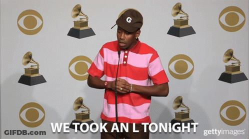 Man In Striped Shirt In Front Of Wall GIF