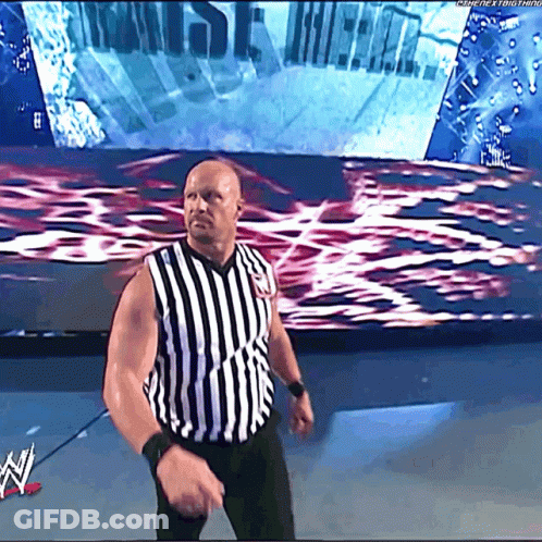 Man In Striped Shirt In Front Of WWE Screen GIF
