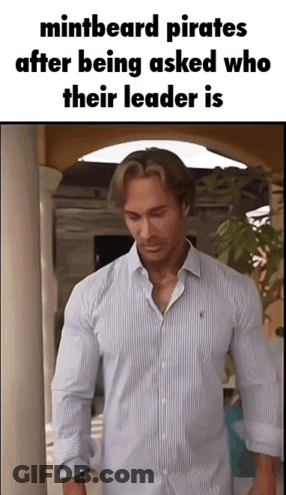 Man In Striped Shirt In Hallway GIF