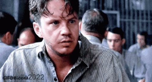 Man In Striped Shirt In Prison Cell With Others GIF