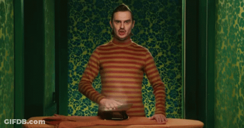 Man In Striped Shirt Ironing GIF