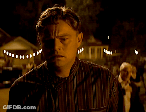 Man In Striped Shirt Looking GIF