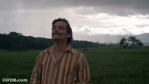 Man In Striped Shirt Looking Up GIF
