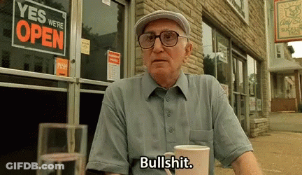 Man In Striped Shirt Making A Face GIF