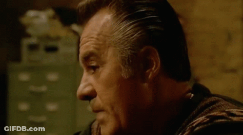 Man In Striped Shirt Making Face GIF