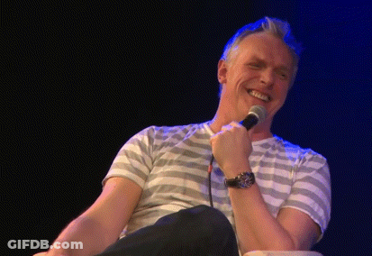 Man In Striped Shirt Making Funny Face GIF