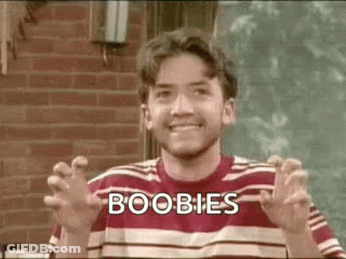 Man In Striped Shirt Making Funny Face Saying Boobs GIF