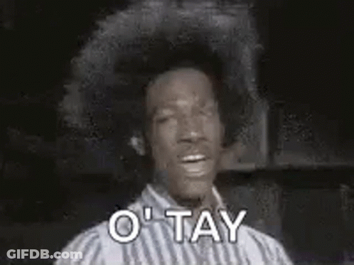 Man In Striped Shirt Making OK Sign GIF