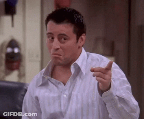 Man In Striped Shirt Pointing And Making Face GIF