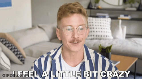 Man In Striped Shirt Saying I Feel Crazy GIF