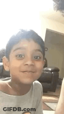 Man In Striped Shirt Saying Not A Baby Face GIF