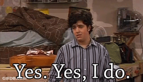 Man In Striped Shirt Saying Yes GIF