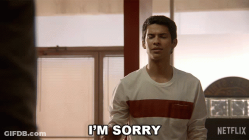 Man In Striped Shirt Says I'm Sorry GIF