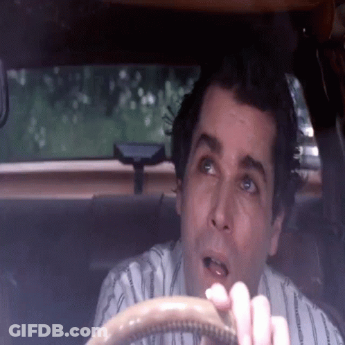 Man In Striped Shirt Sitting In Car With Mouth Open GIF